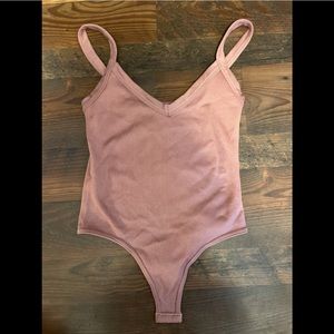 light pink body suit